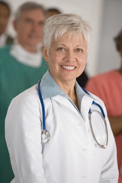 Comstock Images/Comstock/Getty Images Oncologists help provide medicinal relief to cancer patients