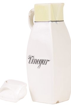 Hemera Technologies/PhotoObjects.net/Getty Images White vinegar helps to neutralize odors.