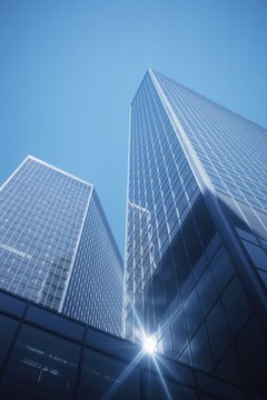 Hemera Technologies/Photos.com/Getty Images REIT companies own office buildings, shopping centers and hotels.