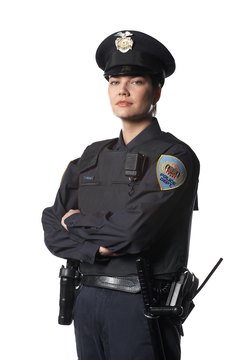 PhotoObjects.net/PhotoObjects.net/Getty Images Police officers identify themselves through their uniforms and badges.