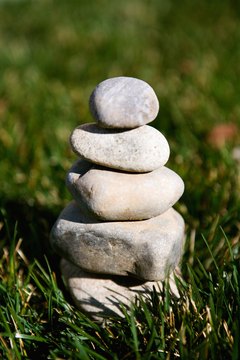 While flowers wither and die, stones represent permanence.