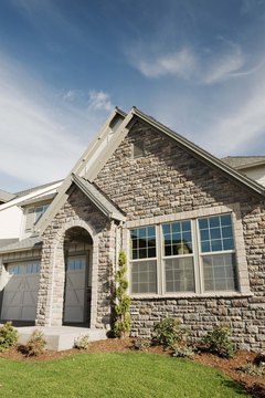 Jupiterimages/Comstock/Getty Images You'll need to keep your homeowners insurance policy at least until your mortgage is paid off.