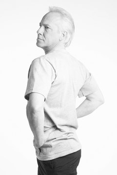 Hemera Technologies/AbleStock.com/Getty Images Stretching can unstiffen an uncomfortable back.