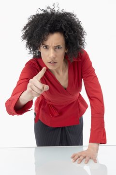 BananaStock/BananaStock/Getty Images Your leadership style influences the performance of your employees..
