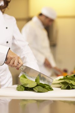 Nick White/Digital Vision/Getty Images Chefs often work in close quarters near hot ovens and various sharp cooking utensils.