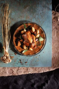 Jupiterimages/Comstock/Getty Images Roast a chicken for a low-fat and high-protein meal.