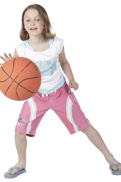 NA/PhotoObjects.net/Getty Images Basketball beginners should first learn how to dribble the ball.