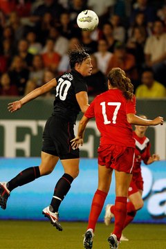 Jonathan Ferrey/Getty Images Sport/Getty Images Abby Wambach heads the ball against Canada.