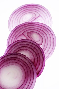 Visage/Stockbyte/Getty Images Purple onions provide vitamin C and flavonoids, antioxidants that protect cells from damage.