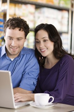 Jupiterimages/Brand X Pictures/Getty Images Sit down with your mate to begin to complete your personal budget.