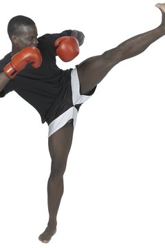 Photos.com/PhotoObjects.net/Getty Images Because kickboxing is high-impact, consult a physician before starting if you're new to fitness.