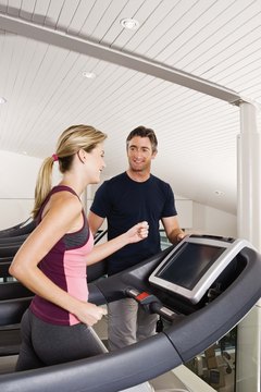 Jupiterimages/Goodshoot/Getty Images Running on the treadmill burns about as many calories as biking.