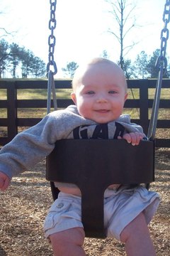 Babies in swings should never be more than an arm's length away from a parent.
