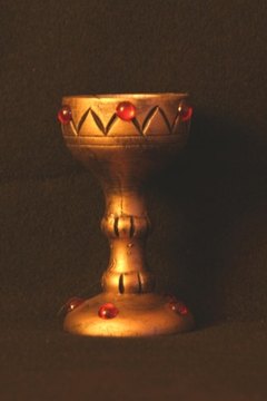 Eucharistic ministers clean chalices. and bowls after Mass.