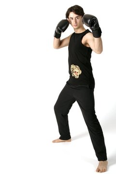 A strong-side-back stance (as displayed by this right-handed boxer) is effective for an extremely powerful blow with the weight of your entire body behind it.