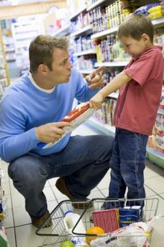 Dad reprimanding son