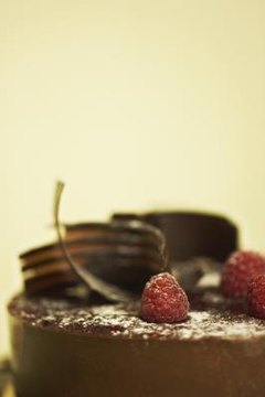 An acetate strip that is 30 inches long and 3 inches wide is used to wrap a 9-inch round cake.