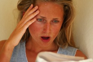 Woman reading newspaper