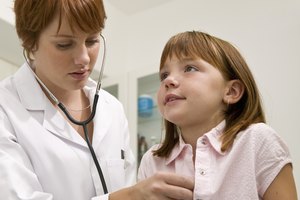 Doctor examining girl