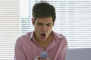 Man screaming at cell phone