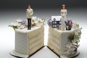 Bride and groom figurines standing on two separated slices of wedding cake