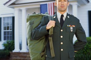 Portrait of young man wearing a military uniform, holding a bag