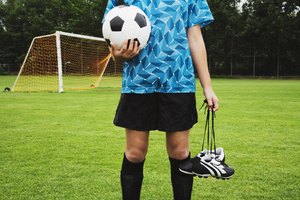 Girl holding soccer ball