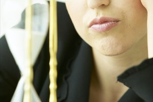 Woman staring at hourglass