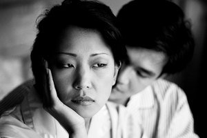 black and white view of a couple upset with each other