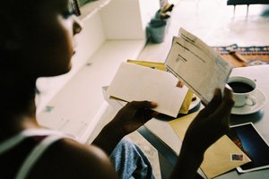 Close-up of a person sorting mail