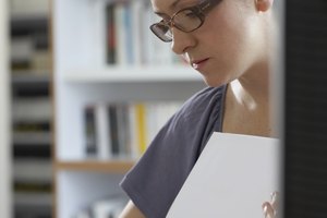 woman looks through folders