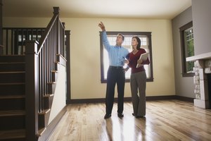 Man and woman inspecting empty house