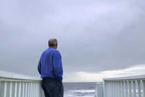 Man standing on boardwalk at beach, North Carolina