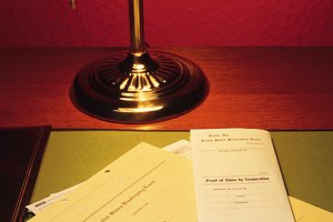Legal documents on desk with lamp and broken pencil