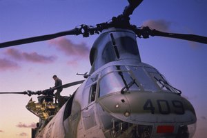 Man on military helicopter