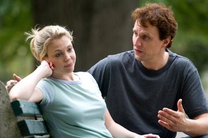 Couple having argument on park bench