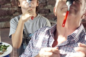 grandfather and grandson playing with spoons