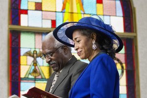 Couple reading Bible in church