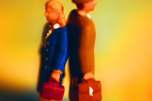 Businesspeople figurine standing back to back, side view