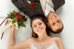 High angle view of wedding couple lying together