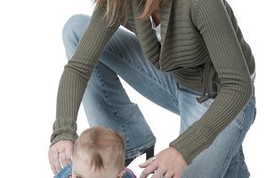 Mother with crawling baby girl