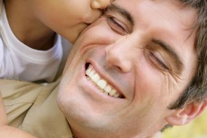 Daughter kissing father