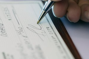 Hand signing a check