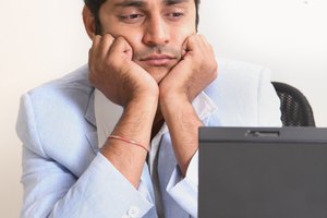 A man looking into his laptop