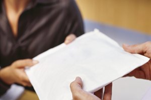 businesswoman receiving a parcel in an office