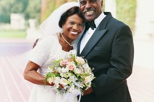 Portrait of a Happy Senior Newlywed Couple Standing in a Garden