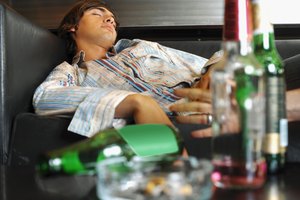 Young man sleeping in a bar