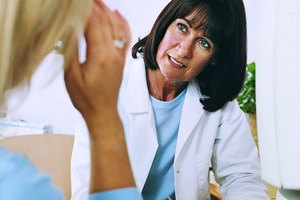 Doctor Listening to Patient Talking About Her Medical Symptoms