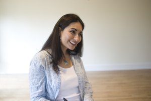 Woman signing real estate contract