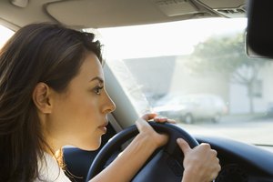 Young woman driving car